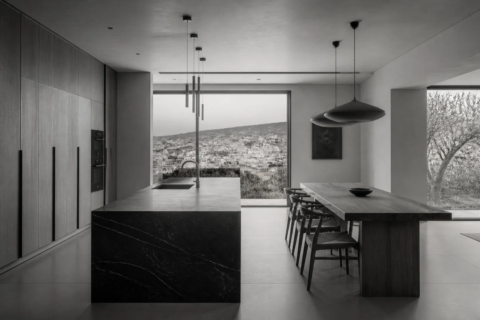 Minimal kitchen and dining room overlooking the hills of Nablus